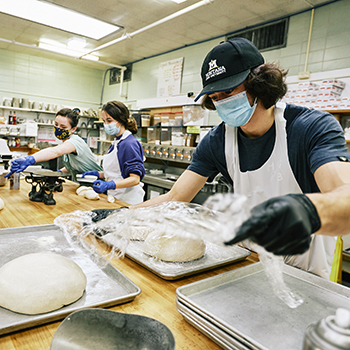 Student employees helping bake