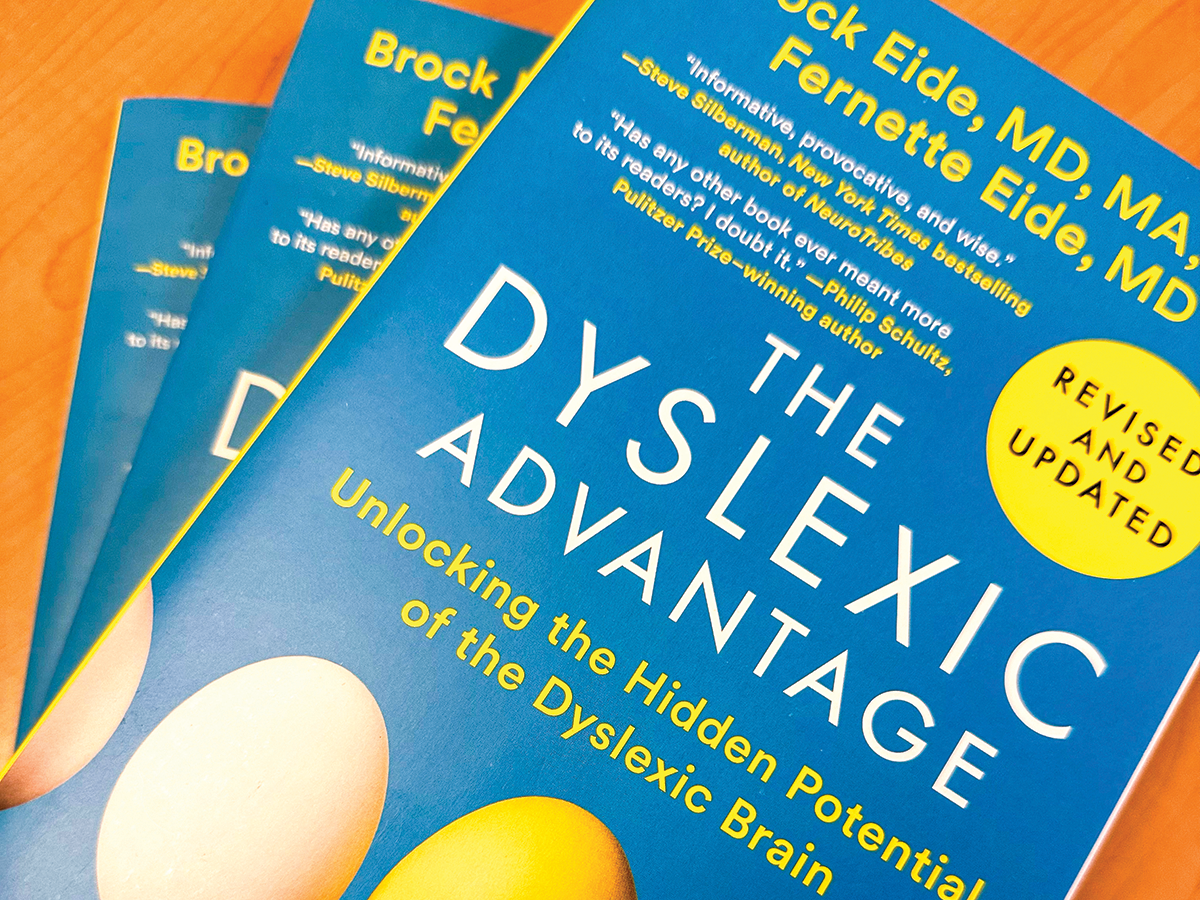 A blue book with the title 'The Dyslexic Advantage' on the front