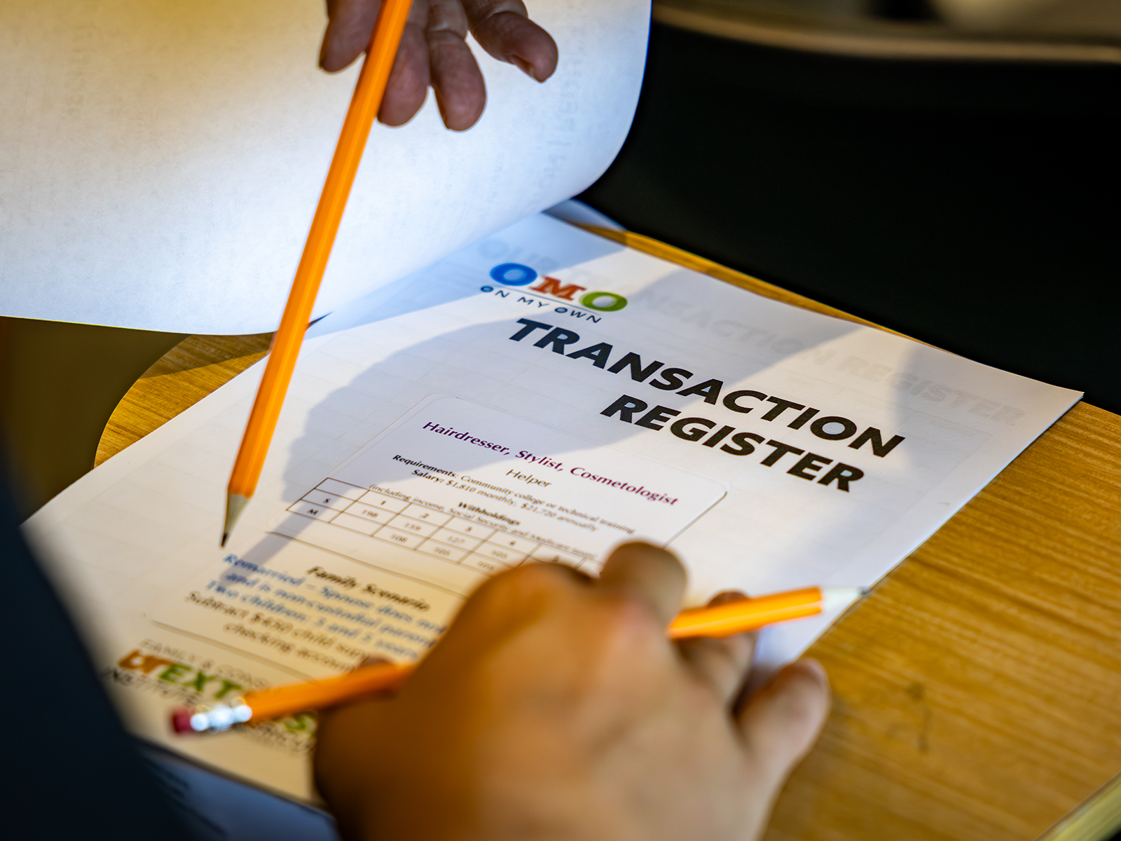 4-H member filling out a worksheet