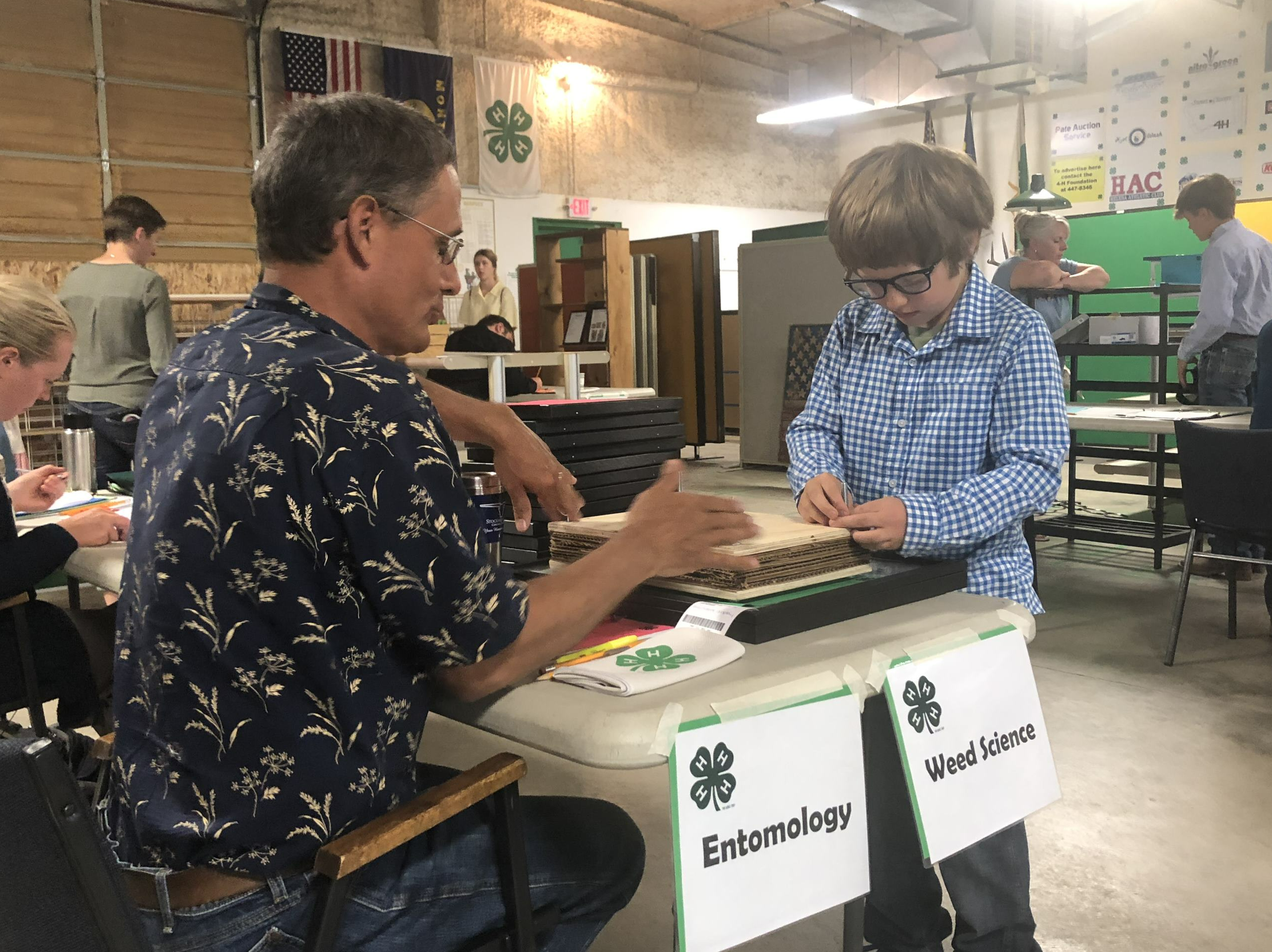 4-H volunteer and member talking about entomology