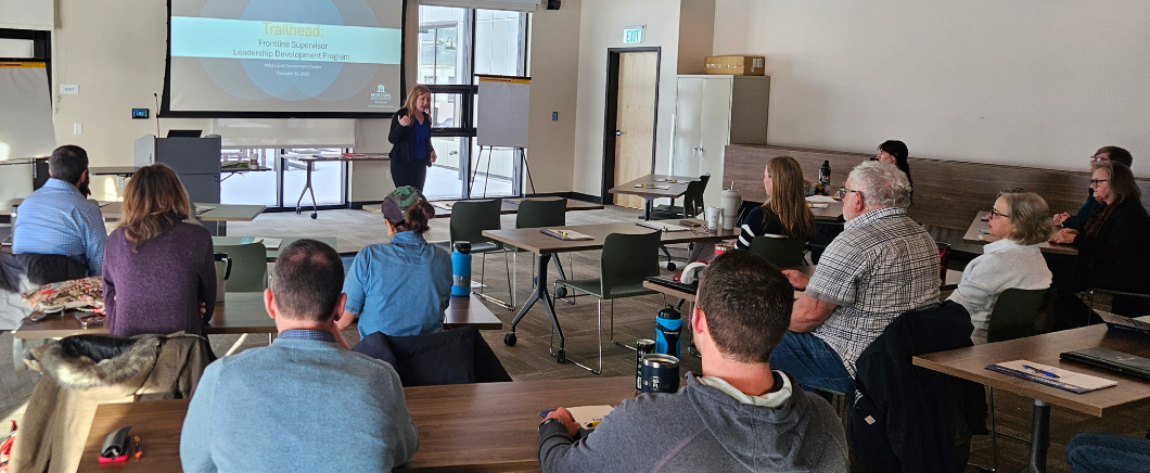 a group of people gathered to listen to the speaker