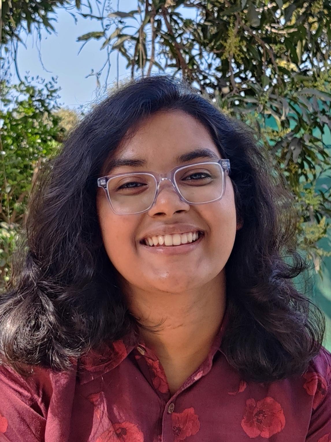 A girl smiles at the camera