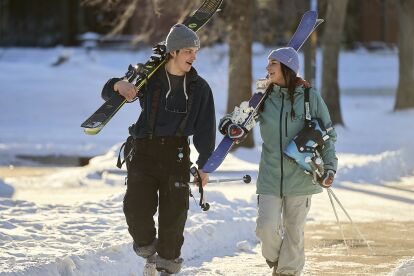 Students carry ski gear across campus for a day at one of the region’s two ski area.