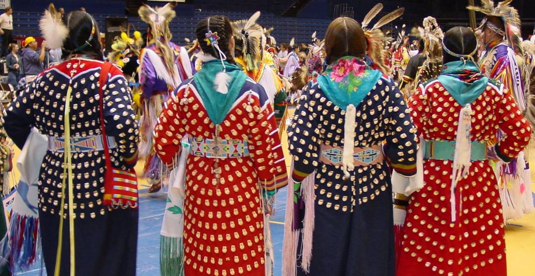 female-presenting dancers at powwow