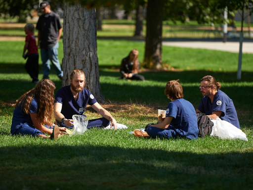 students sitting outside