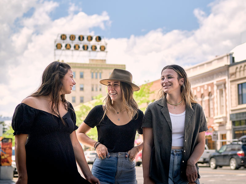 Photo of three students walking in downtown Bozeman