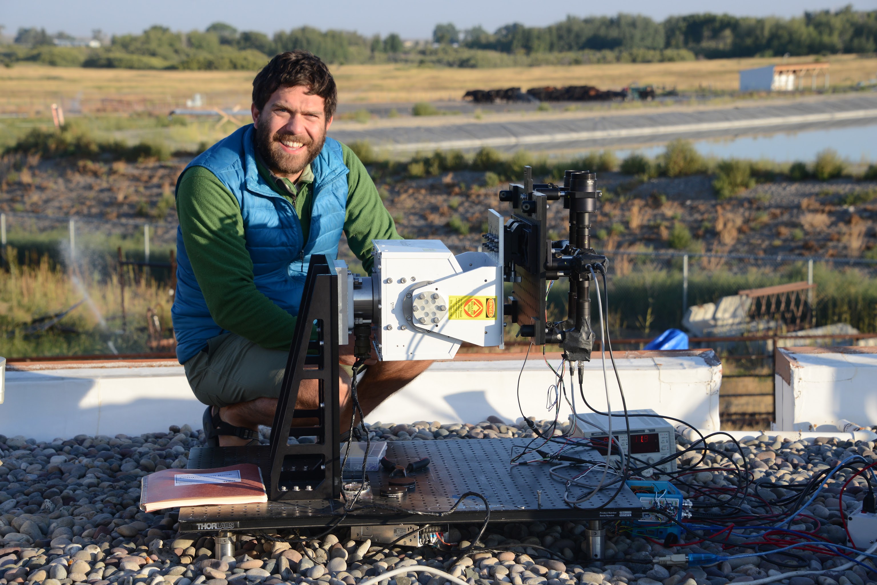 Researcher with optics equipment