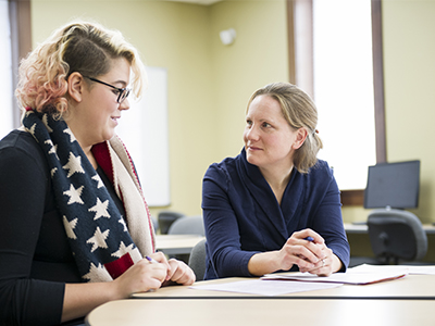 Advisor speaking with a student